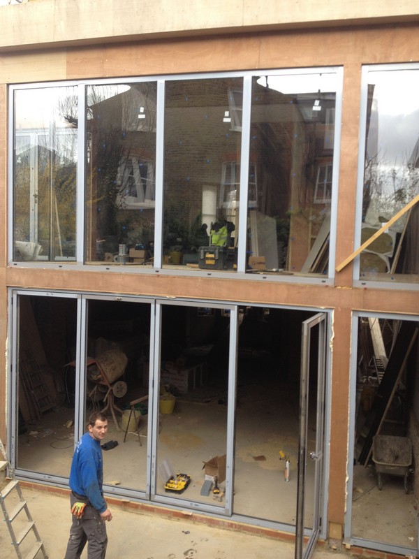 Aluminium bi-fold doors with two-storey glazing in Marlow