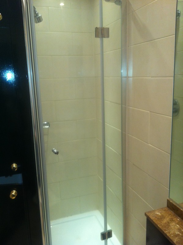 Frameless glass shower enclosure with chrome fittings in Marlow