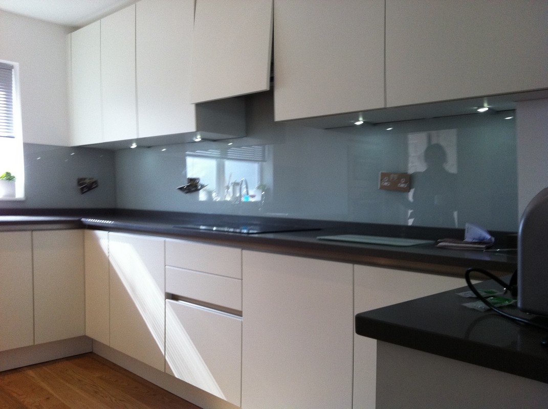 Grey glass kitchen splashback with LED lighting in Marlow