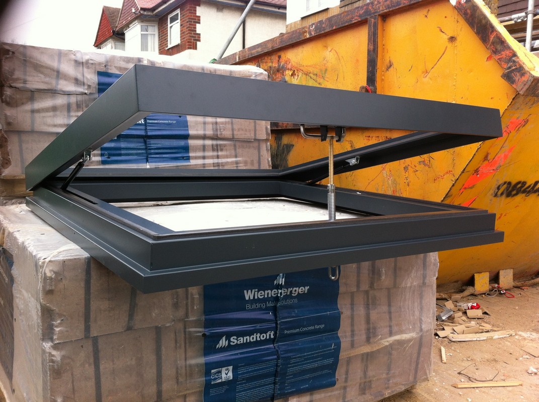 Opening flat roof skylight in anthracite grey installed in Marlow